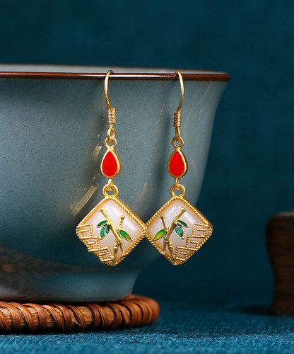 Pendientes colgantes de hoja de bambú con incrustaciones de jade y gemas de cobre dorado