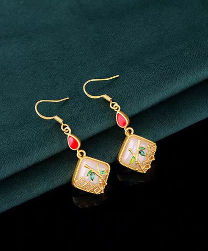 Pendientes colgantes de hoja de bambú con incrustaciones de jade y gemas de cobre dorado