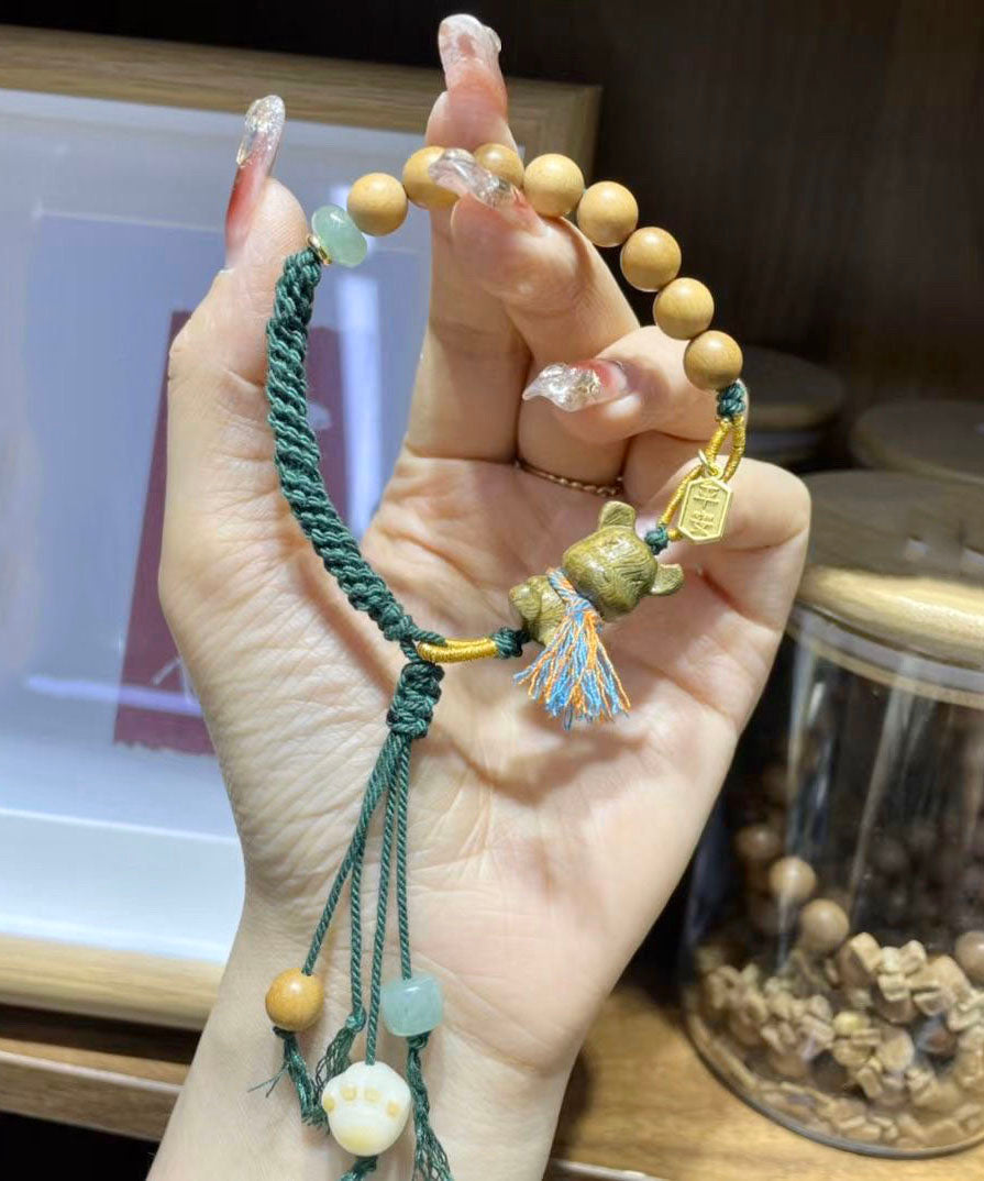 Pulsera Art con dije de oso de sándalo verde