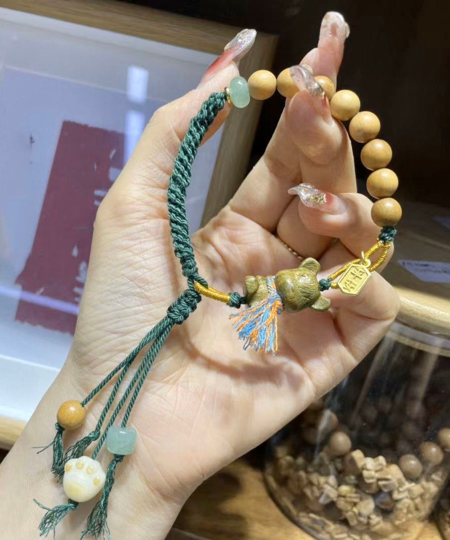 Pulsera Art con dije de oso de sándalo verde
