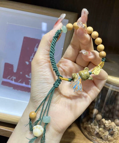 Pulsera Art con dije de oso de sándalo verde