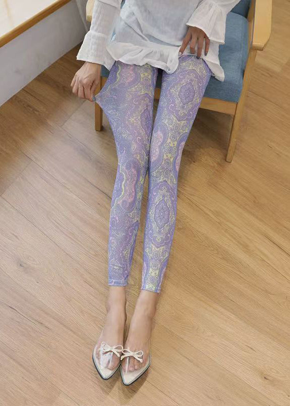 Leggings mit hellviolettem Print, gerafftem Mesh-Einsatz am Po und Capri-Leggings