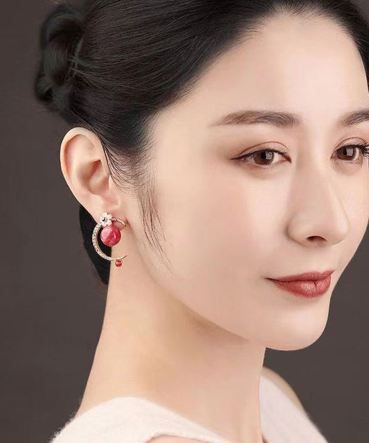 Pendientes colgantes con diseño floral de concha y gemas de circonita en plata de ley rosa