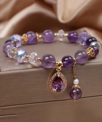 Pulsera con dije de amor de circonita y cuentas de cristal morado