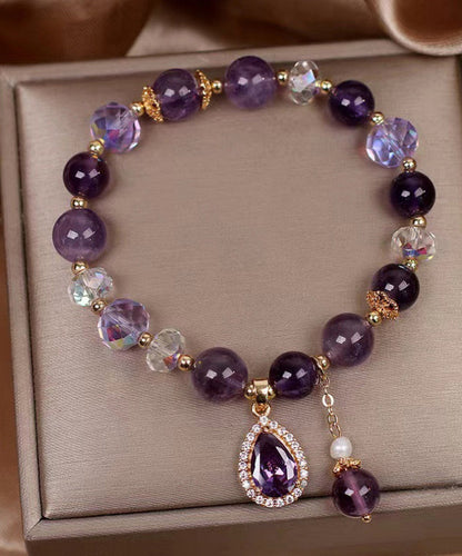 Pulsera con dije de amor de circonita y cuentas de cristal morado
