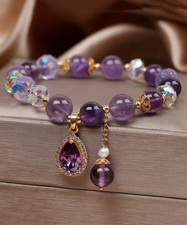 Pulsera con dije de amor de circonita y cuentas de cristal morado