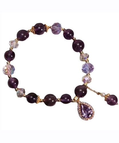 Pulsera con dije de amor de circonita y cuentas de cristal morado