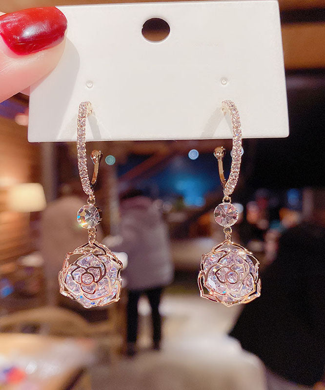 Pendientes colgantes de rosa hueca con circonitas doradas en plata de ley