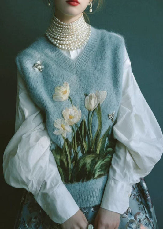 Hermoso chaleco de punto bordado con cuello en V azul sin mangas