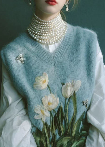 Hermoso chaleco de punto bordado con cuello en V azul sin mangas