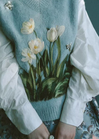 Hermoso chaleco de punto bordado con cuello en V azul sin mangas