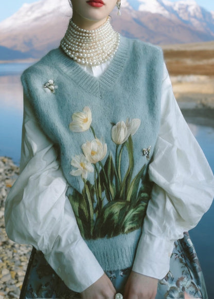 Hermoso chaleco de punto bordado con cuello en V azul sin mangas