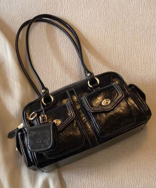 Hermoso bolso de mano de piel sintética con bolsillos marrones