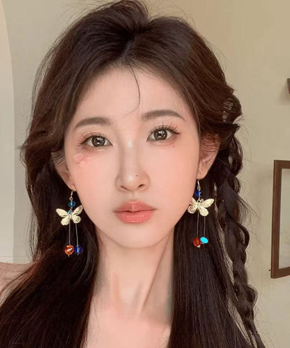 Hermosos aretes colgantes con borlas y cuentas de mariposa de aleación con bloques de color