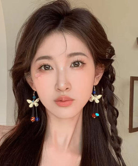 Hermosos aretes colgantes con borlas y cuentas de mariposa de aleación con bloques de color