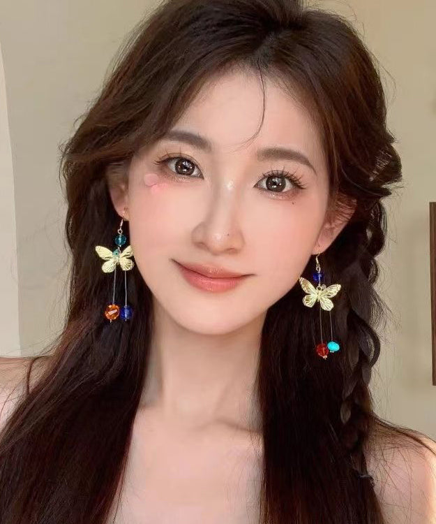 Hermosos aretes colgantes con borlas y cuentas de mariposa de aleación con bloques de color
