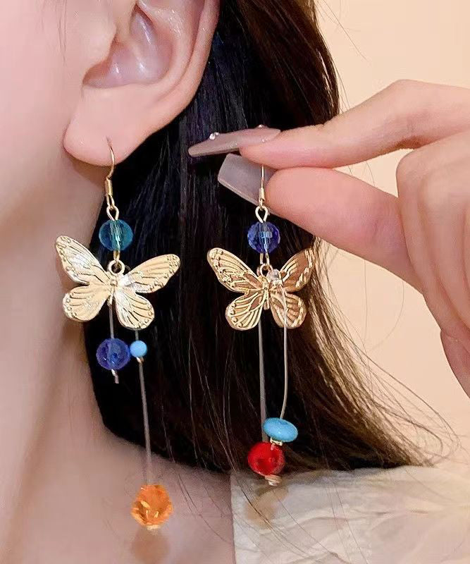 Hermosos aretes colgantes con borlas y cuentas de mariposa de aleación con bloques de color