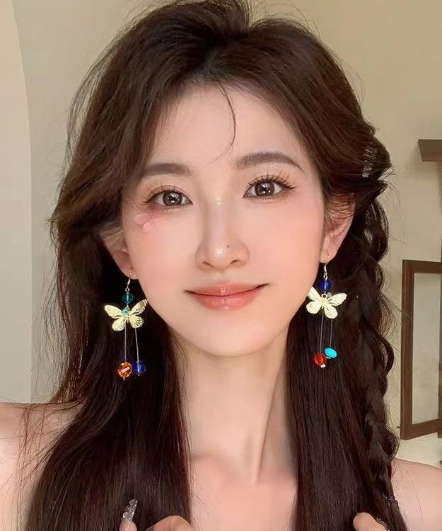 Hermosos aretes colgantes con borlas y cuentas de mariposa de aleación con bloques de color