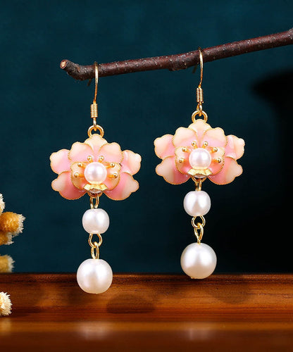 Hermosos aretes colgantes florales con perlas acrílicas doradas y cobre en bloques de color