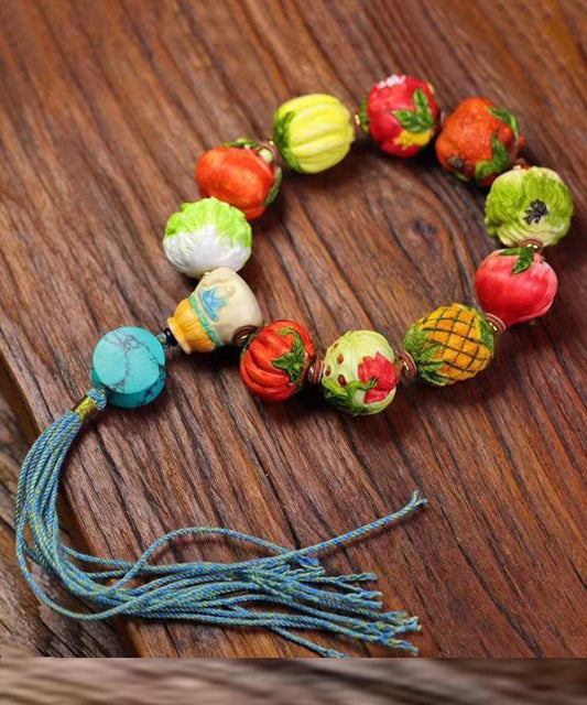 Wunderschönes Colorblock-Handstrickarmband mit Obst- und Gemüsequaste