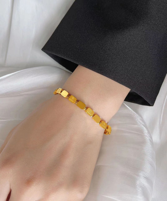 Wunderschönes goldenes Edelstahl-Armband mit Schlangenknochen-Kette und quadratischem Anhänger