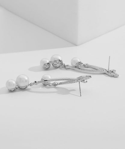 Hermosos aretes colgantes de plata esterlina dorada con perla y circonita