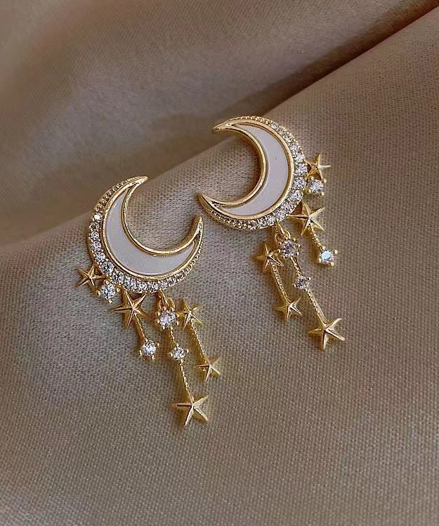 Hermosos aretes colgantes de luna y estrella con circonitas doradas en plata esterlina