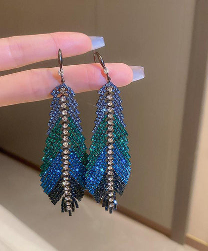 Hermosos aretes colgantes con borlas y hojas de plumas de circonita de cobre múltiple