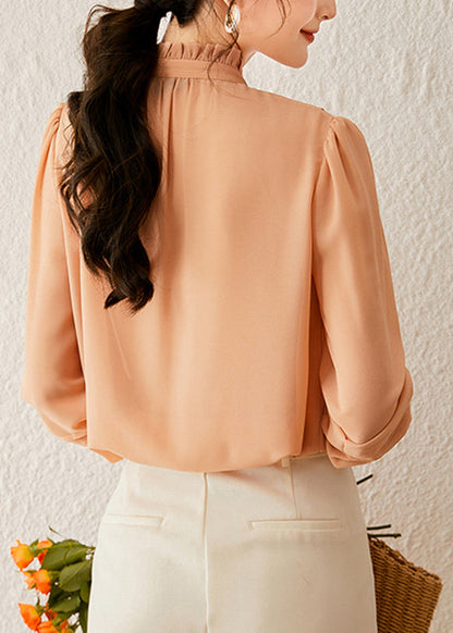 Hermosos tops de cuello alto naranja con mangas farol