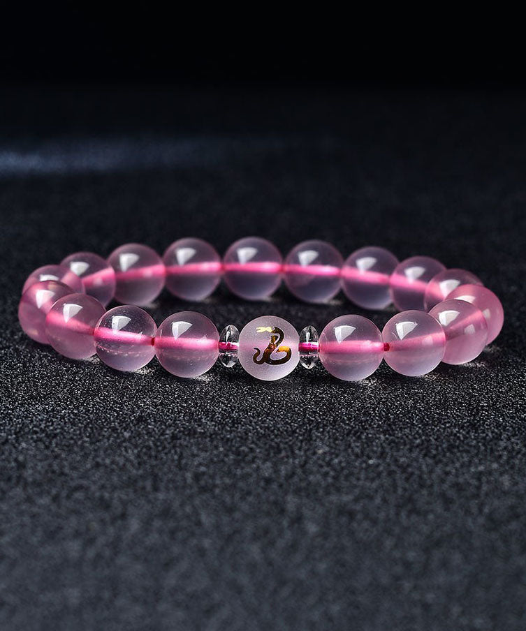 Hermosa pulsera de cristal rosa con los doce signos del zodiaco chino