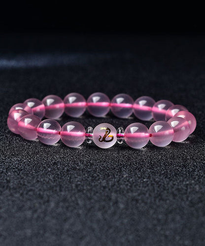 Hermosa pulsera de cristal rosa con los doce signos del zodiaco chino