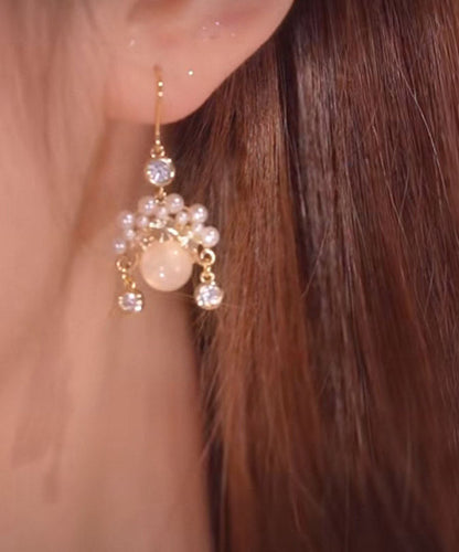 Hermosos aretes colgantes de ópalo perlado rosa