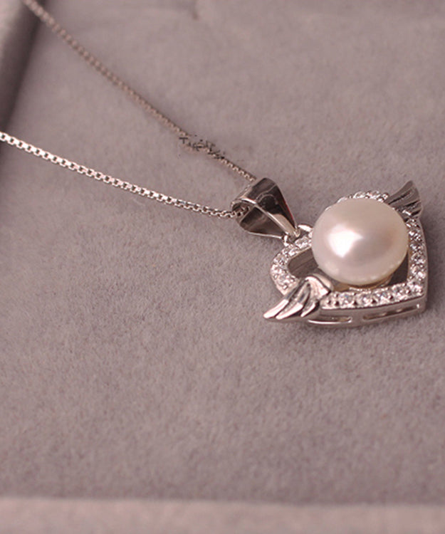 Hermoso collar con colgante de circonita y perla dorada en plata de ley rosa