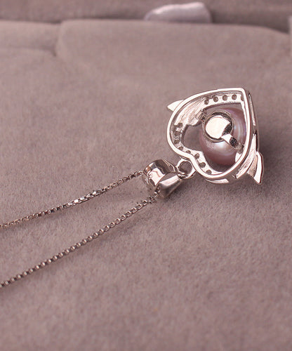 Hermoso collar con colgante de circonita y perla dorada en plata de ley rosa