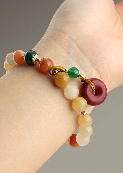 Hermosa pulsera con dijes de cinabrio, calabaza, calcedonia, ágata verde y jade rojo