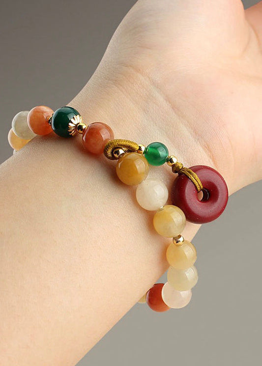 Hermosa pulsera con dijes de cinabrio, calabaza, calcedonia, ágata verde y jade rojo