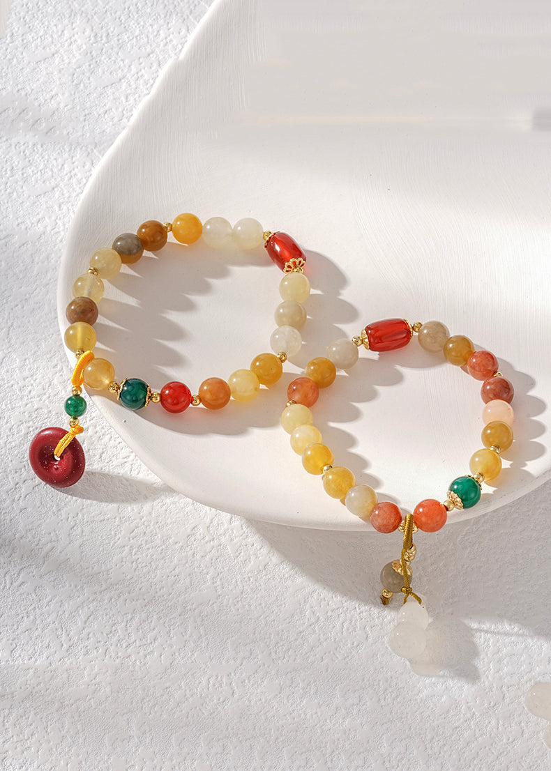 Hermosa pulsera con dijes de cinabrio, calabaza, calcedonia, ágata verde y jade rojo