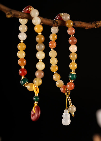 Hermosa pulsera con dijes de cinabrio, calabaza, calcedonia, ágata verde y jade rojo