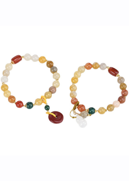 Hermosa pulsera con dijes de cinabrio, calabaza, calcedonia, ágata verde y jade rojo