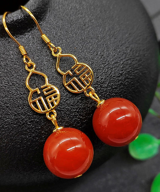 Hermosos aretes colgantes con diseño gráfico de ágata dorada en plata de ley roja