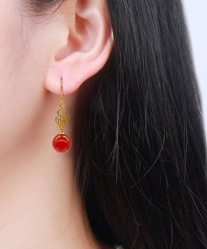 Hermosos aretes colgantes con diseño gráfico de ágata dorada en plata de ley roja