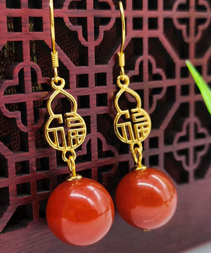 Hermosos aretes colgantes con diseño gráfico de ágata dorada en plata de ley roja