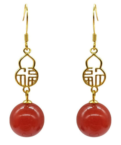 Hermosos aretes colgantes con diseño gráfico de ágata dorada en plata de ley roja