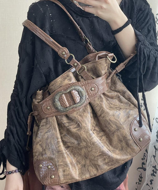 Hermoso bolso de piel sintética con cordón y diseño de rosas