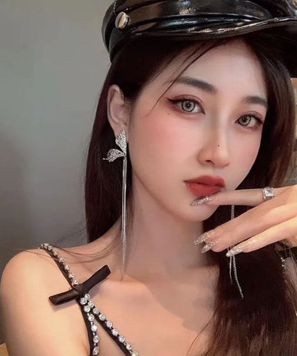 Wunderschöne Ohrringe mit Schmetterlingsquaste aus Seide und Kupferlegierung