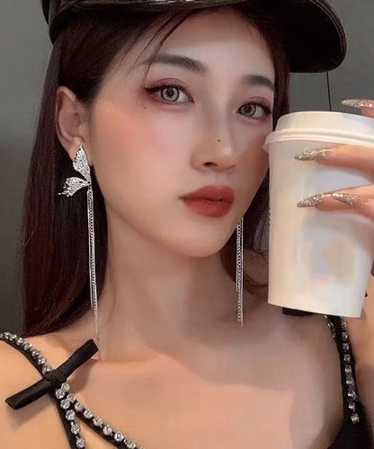 Wunderschöne Ohrringe mit Schmetterlingsquaste aus Seide und Kupferlegierung