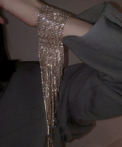 Hermosa pulsera de cadena con borlas de circonitas de seda