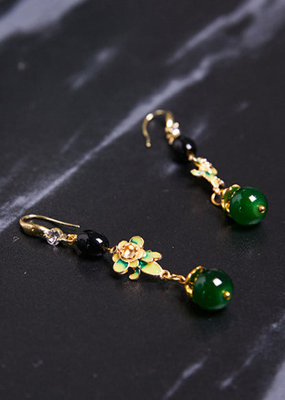 Hermosos aretes colgantes de flores finas de color turquesa