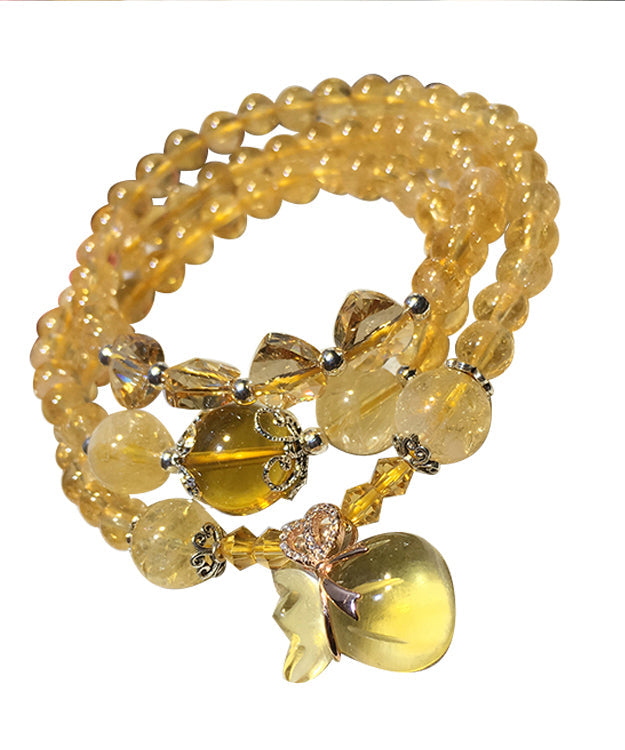 Hermosa pulsera con dijes de rosario de cristal amarillo de múltiples vueltas