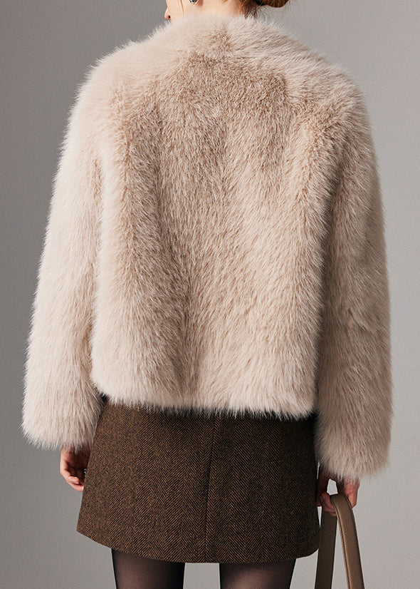 Abrigo de invierno de piel y cuero beige con bolsillos y cremallera y cuello Peter Pan